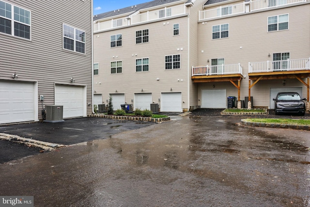 rear view of property with cooling unit