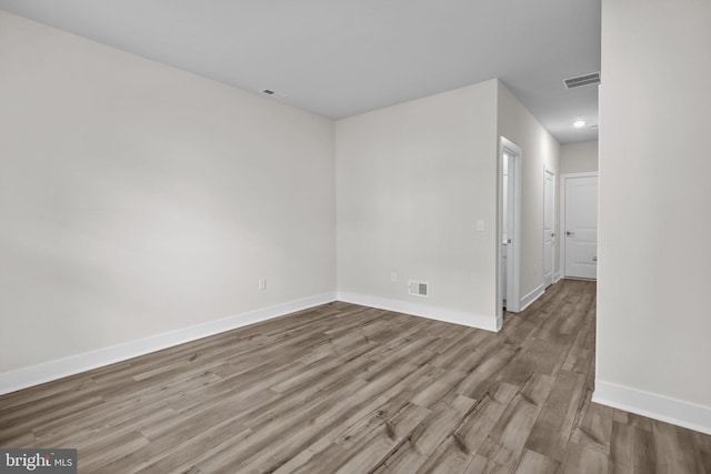 empty room with light wood-type flooring