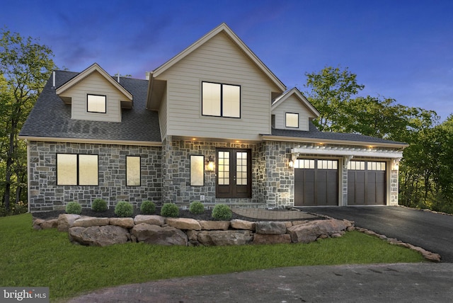 view of front facade featuring french doors and a garage