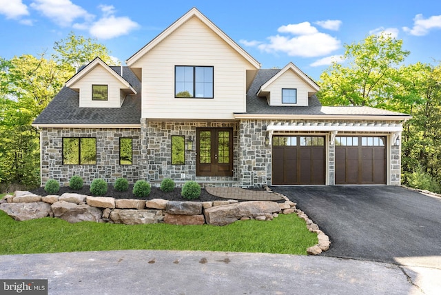 view of front of property featuring a garage and french doors