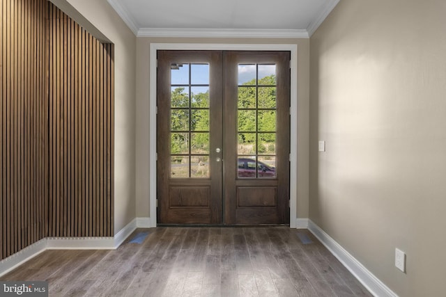 doorway featuring french doors, ornamental molding, and hardwood / wood-style floors