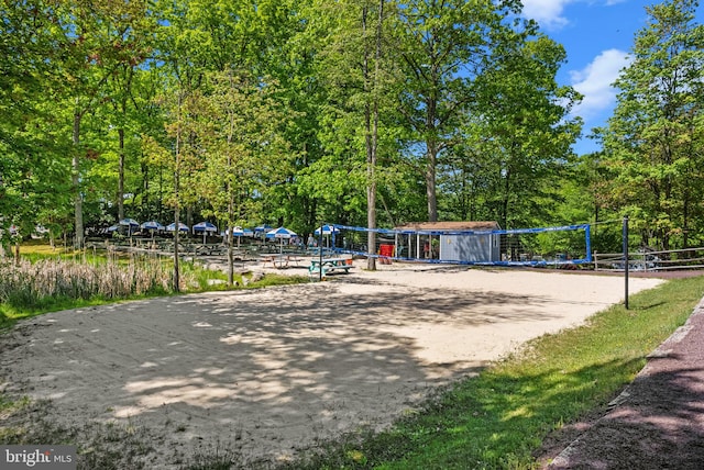 view of home's community featuring volleyball court