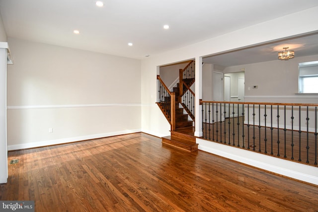 spare room with hardwood / wood-style floors