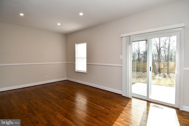 empty room with hardwood / wood-style flooring