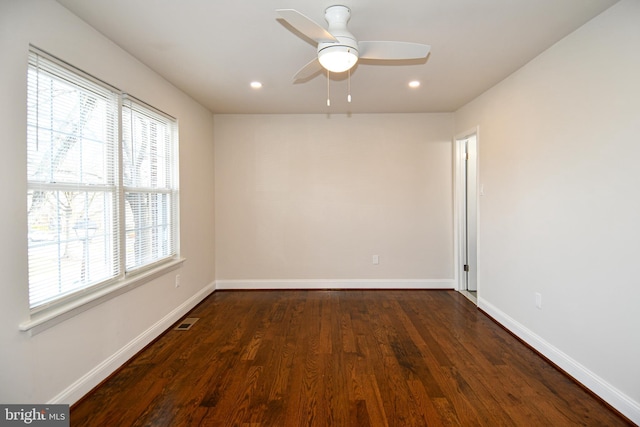 unfurnished room featuring dark hardwood / wood-style floors and ceiling fan