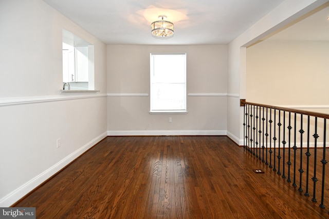 unfurnished room featuring dark hardwood / wood-style floors