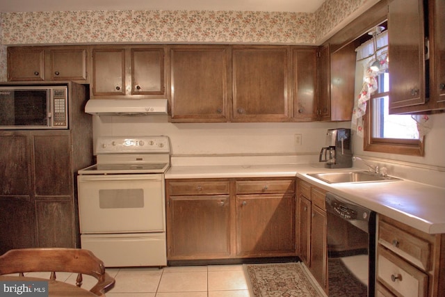 kitchen featuring sink, electric stove, black dishwasher, and light tile patterned floors