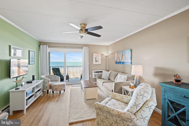 living room featuring ceiling fan, a baseboard radiator, a wall mounted AC, light wood-type flooring, and ornamental molding