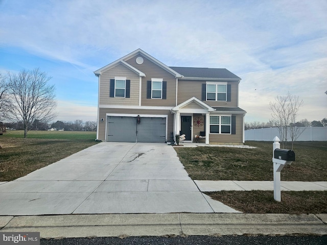 view of front of property featuring a garage and a front yard