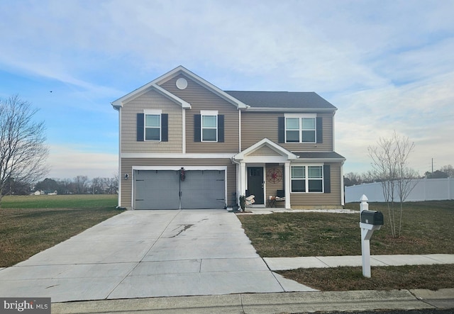 view of front of home with a front yard and a garage