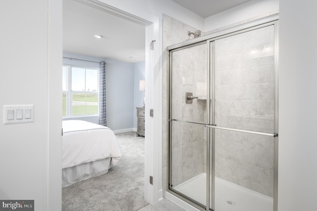 bathroom with a shower with shower door