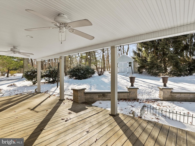 snow covered deck with a storage unit and ceiling fan