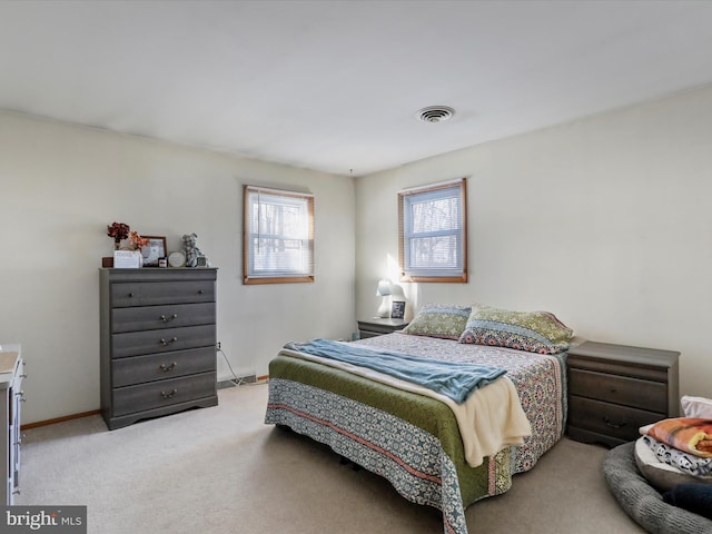 bedroom with light carpet