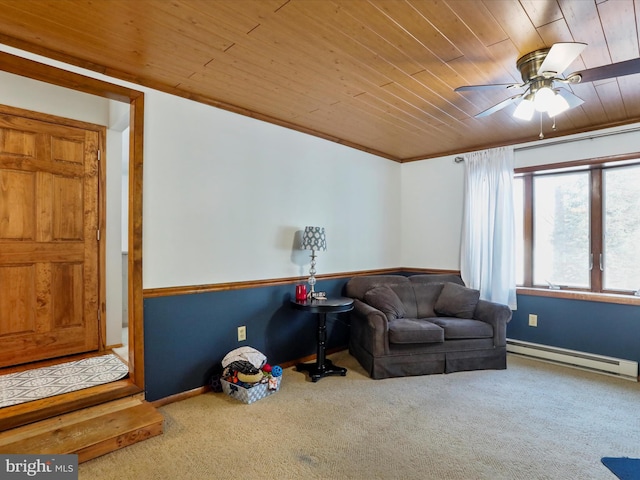 sitting room with baseboard heating, ceiling fan, carpet flooring, and wooden ceiling