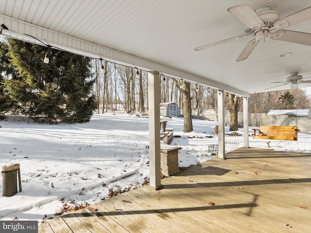 snow covered deck with ceiling fan