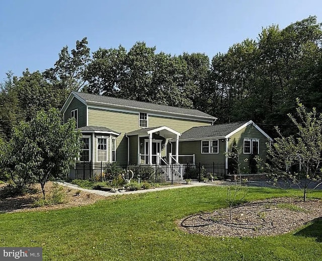 view of front of home featuring a front yard and a porch