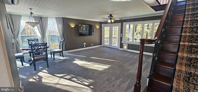 interior space with ceiling fan