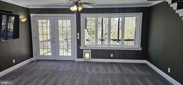 doorway with french doors, dark carpet, ceiling fan, and crown molding