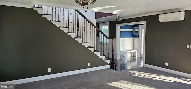 interior space with carpet flooring, a textured ceiling, an AC wall unit, and ornamental molding