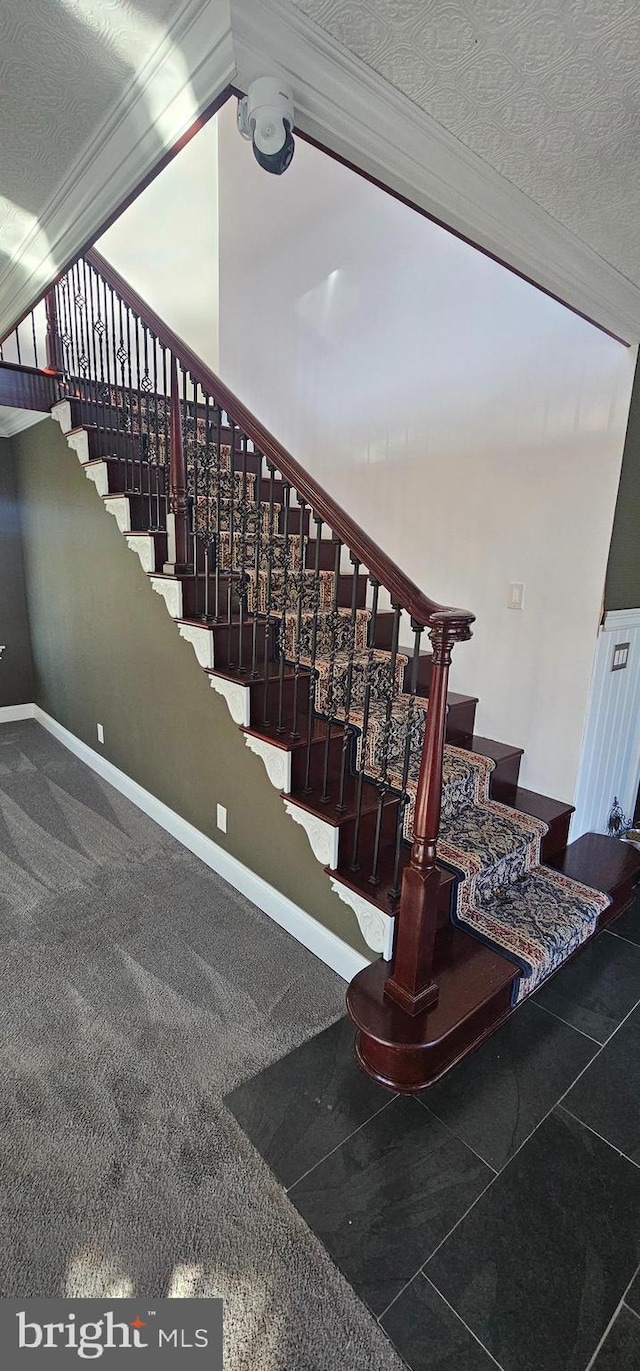 stairway with a textured ceiling