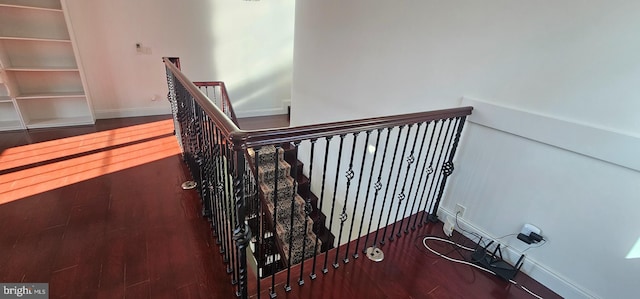 staircase featuring hardwood / wood-style flooring