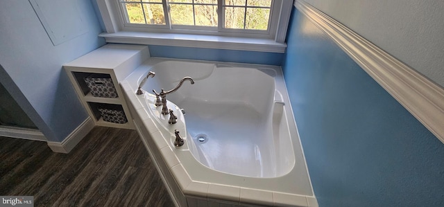 bathroom with a bathing tub and wood-type flooring