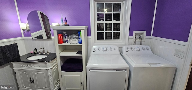 laundry area featuring sink and washing machine and clothes dryer