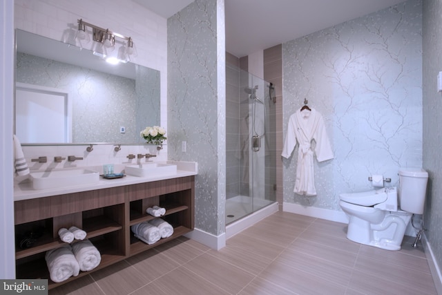 bathroom with tile patterned flooring, vanity, toilet, and walk in shower