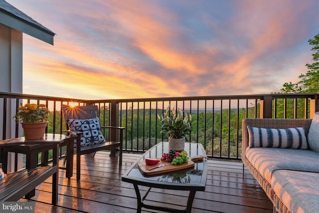 view of balcony at dusk