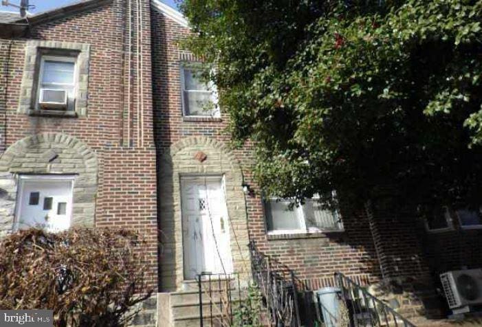 view of front of home with cooling unit