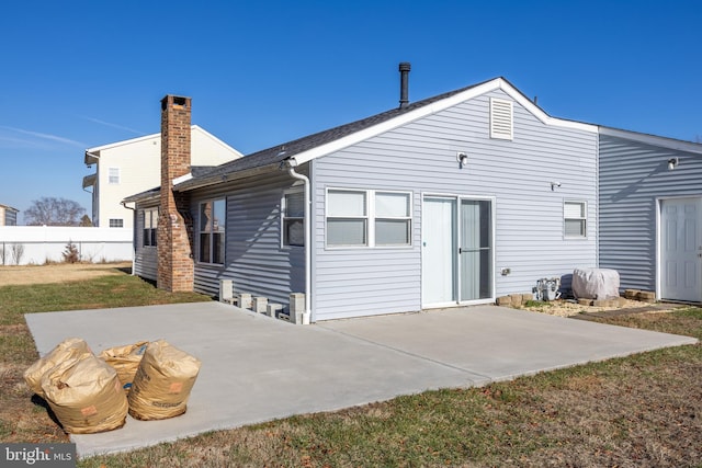 back of property with a patio area