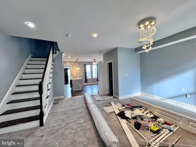 507 N Loudon Ave, Baltimore, MD 21229 - unfurnished living room featuring carpet floors, stairs, a chandelier, ceiling fan, and recessed lighting