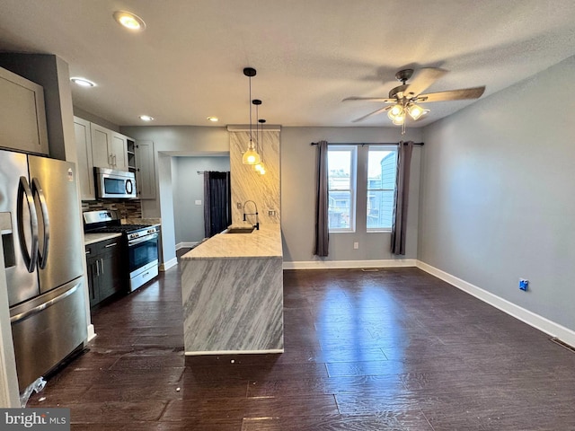507 N Loudon Ave, Baltimore, MD 21229 - kitchen with appliances with stainless steel finishes, a ceiling fan, light countertops, tasteful backsplash, and recessed lighting