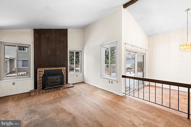 unfurnished living room featuring a brick fireplace, high vaulted ceiling, beam ceiling, and carpet