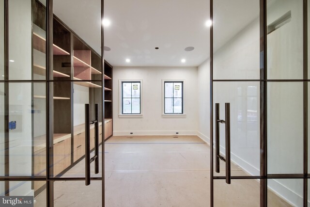 913 Drexel Ln, Bryn Mawr, PA 19010 - spare room with french doors and concrete flooring