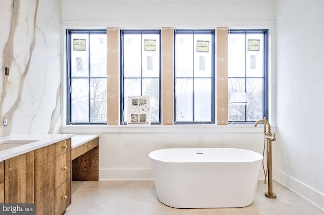 913 Drexel Ln, Bryn Mawr, PA 19010 - full bath with vanity, a soaking tub, and baseboards
