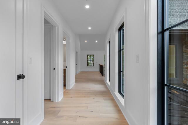 913 Drexel Ln, Bryn Mawr, PA 19010 - hall featuring light wood finished floors, beverage cooler, recessed lighting, and baseboards