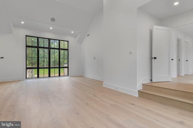 913 Drexel Ln, Bryn Mawr, PA 19010 - unfurnished living room with light wood-style flooring, recessed lighting, baseboards, and high vaulted ceiling