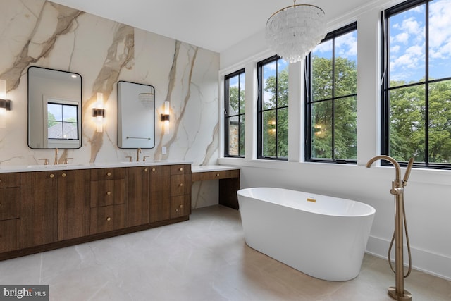 913 Drexel Ln, Bryn Mawr, PA 19010 - full bath with plenty of natural light, a soaking tub, and double vanity