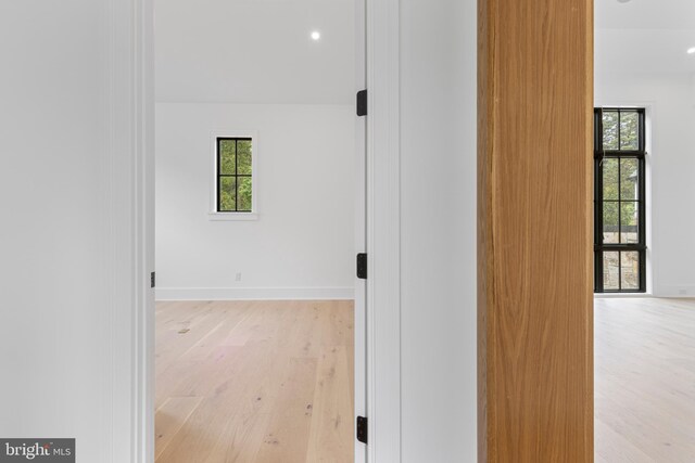 913 Drexel Ln, Bryn Mawr, PA 19010 - hallway featuring light wood finished floors, healthy amount of natural light, baseboards, and recessed lighting