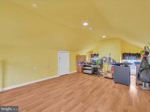 bonus room with light hardwood / wood-style floors and lofted ceiling