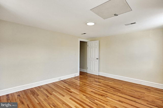 unfurnished room featuring light hardwood / wood-style flooring