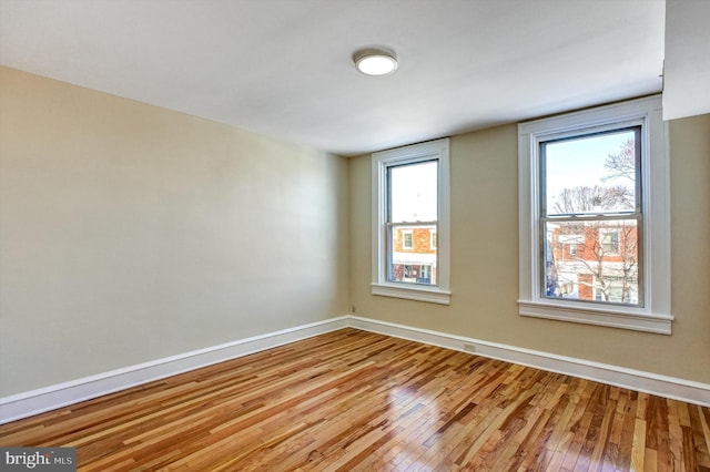 empty room with light wood-type flooring