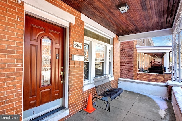 doorway to property featuring covered porch