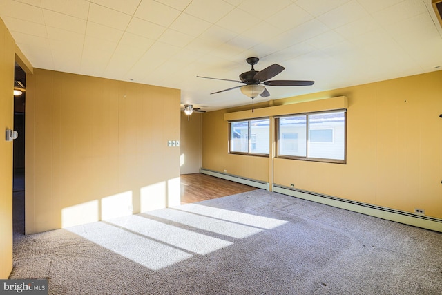 spare room featuring ceiling fan, a baseboard radiator, and carpet flooring