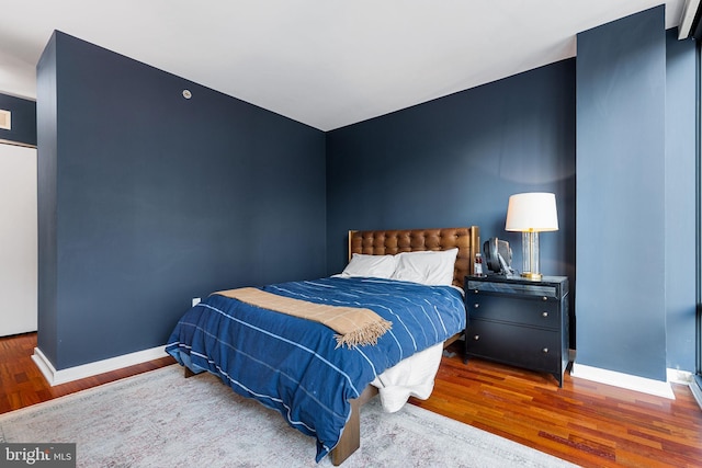 bedroom with hardwood / wood-style floors