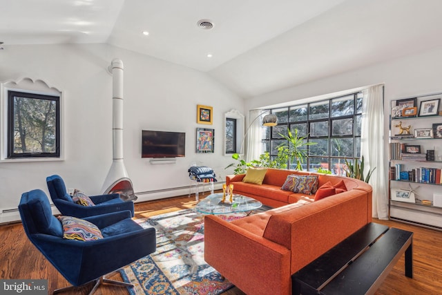 living room featuring wood-type flooring, baseboard heating, and vaulted ceiling