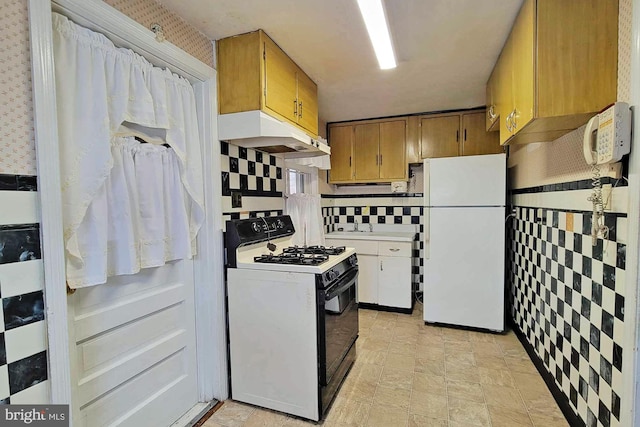 kitchen with white appliances and backsplash