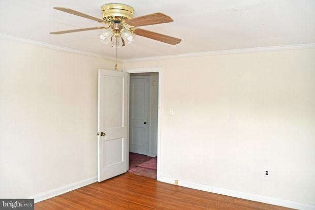 empty room with ceiling fan, ornamental molding, and hardwood / wood-style flooring