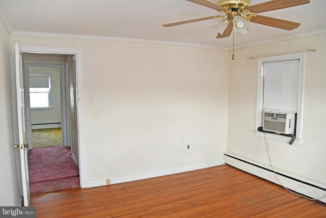 unfurnished room with hardwood / wood-style floors, a baseboard radiator, and ornamental molding